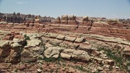 5.5K aerial stock footage of flying by canyons between rock formations, Canyonlands National Park, Utah Aerial Stock Footage | AX136_213