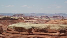 5.5K aerial stock footage of flying by rock formations in Canyonlands National Park, Utah Aerial Stock Footage | AX136_219E