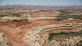 5.5K aerial stock footage of flying over rock formations and shallow canyons, Canyonlands National Park, Utah Aerial Stock Footage | AX136_221
