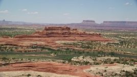 5.5K aerial stock footage of passing by Squaw Butte at Canyonlands National Park, Utah Aerial Stock Footage | AX136_224E