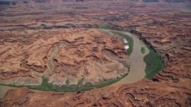 5.5K aerial stock footage of flying by Colorado River through Meander Canyon, Canyonlands National Park, Utah Aerial Stock Footage | AX136_258