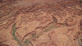 5.5K aerial stock footage tilt from buttes, reveal Colorado River and Meander Canyon, Canyonlands National Park, Utah Aerial Stock Footage | AX136_259E