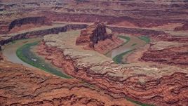 5.5K aerial stock footage of the Colorado River and a butte in Goose Neck part of Meander Canyon, Canyonlands National Park, Utah Aerial Stock Footage | AX136_264E