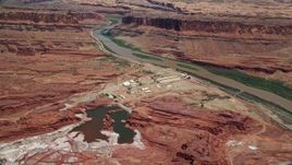 5.5K aerial stock footage of approaching Intrepid Potash plant by Colorado River, Moab, Utah Aerial Stock Footage | AX136_275