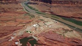 5.5K aerial stock footage of a bird's eye view of the Intrepid Potash plant by the Colorado River, Moab, Utah Aerial Stock Footage | AX136_276E
