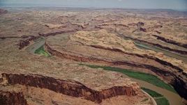 5.5K aerial stock footage of flying toward a loop of Colorado River and rock formations, Moab, Utah Aerial Stock Footage | AX136_278E