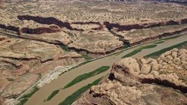 5.5K aerial stock footage of passing by Colorado River and surrounding rock formations, Moab, Utah Aerial Stock Footage | AX136_282
