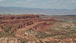 5.5K aerial stock footage of flying by Klondike Bluffs and Marching Men rock formations, Arches National Park, Utah Aerial Stock Footage | AX137_003