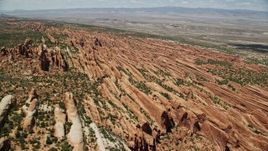 5.5K aerial stock footage of flying by rock fins in Devil's Garden, Arches National Park, Utah Aerial Stock Footage | AX137_013E