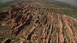 5.5K aerial stock footage of flying over rock fins in Devil's Garden, Arches National Park, Utah Aerial Stock Footage | AX137_015E