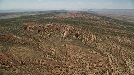 5.5K aerial stock footage of approach rocky landscape of Devil's Garden, Arches National Park, Utah Aerial Stock Footage | AX137_018E