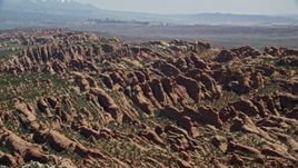 5.5K aerial stock footage of flying by Devil's Garden rock formations at Arches National Park, Utah Aerial Stock Footage | AX137_049