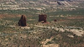 5.5K aerial stock footage of a close orbit of Balanced Rock and Arches Scenic Drive, Arches National Park, Utah Aerial Stock Footage | AX137_065E