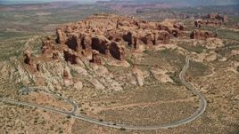 5.5K aerial stock footage fly over and tilt to Elephant Butte and Double Arch, Arches National Park, Utah Aerial Stock Footage | AX137_070E