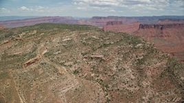 5.5K aerial stock footage fly over the top of Dry Mesa in Moab, Utah Aerial Stock Footage | AX137_081