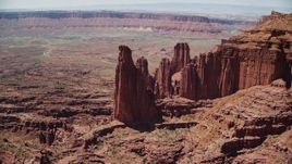 5.5K aerial stock footage of orbiting The Titan near other rock formations at Fisher Towers, Utah Aerial Stock Footage | AX137_103E