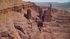 5.5K aerial stock footage of approaching The Titan rock formation at Fisher Towers, Utah Aerial Stock Footage | AX137_106E