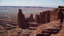 5.5K aerial stock footage approach The Titan and nearby rock formations at Fisher Towers, Utah Aerial Stock Footage | AX137_113
