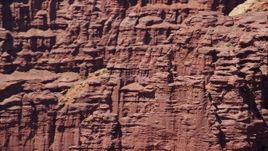 5.5K aerial stock footage of orbiting rock climbers on a formation at Fisher Towers, Utah Aerial Stock Footage | AX137_115E