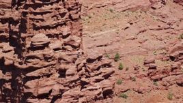 5.5K aerial stock footage of a couple of rock climbers on a rock formation at Fisher Towers, Utah Aerial Stock Footage | AX137_118E