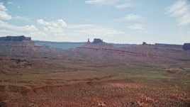 5.5K aerial stock footage of a view of distant desert buttes in Moab, Utah Aerial Stock Footage | AX137_125E