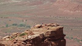 5.5K aerial stock footage orbit two rock climbers on top of Castleton Tower in Moab, Utah Aerial Stock Footage | AX137_139