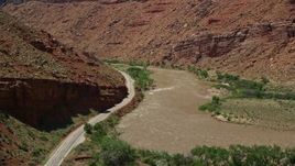 5.5K aerial stock footage of State Route 128 and rapids on the Colorado River in Moab, Utah Aerial Stock Footage | AX137_158