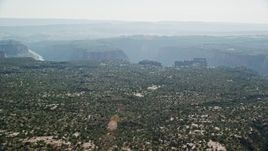 5.5K aerial stock footage of a wide view of Big Bend Canyon in Arches National Park seen from flat desert, Utah Aerial Stock Footage | AX138_019