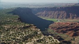 5.5K aerial stock footage of a wide view of the Colorado River seen from cliffs near Moab, Utah Aerial Stock Footage | AX138_020E