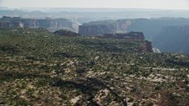 5.5K aerial stock footage fly over cliff to reveal Colorado River and Big Bend, Arches National Park, Utah Aerial Stock Footage | AX138_022E
