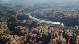 5.5K aerial stock footage of rock formations bordering the Colorado River, Moab, Utah Aerial Stock Footage | AX138_048E