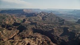 5.5K aerial stock footage of approaching rock formations with mesas in the background, Moab, Utah Aerial Stock Footage | AX138_050E