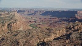 5.5K aerial stock footage of a wide desert canyon and mesas, Moab, Utah Aerial Stock Footage | AX138_052