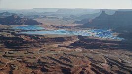 5.5K aerial stock footage of blue potash ponds in the desert, Moab, Utah Aerial Stock Footage | AX138_057