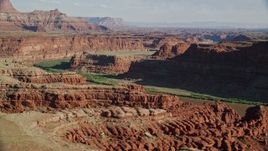 5.5K aerial stock footage of Goose Neck in Meander Canyon, reveal Colorado River, Canyonlands National Park, Utah Aerial Stock Footage | AX138_078