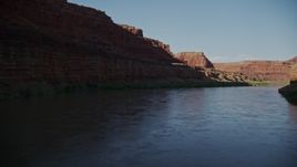 5.5K aerial stock footage pan across canyon cliffs, fly over the river, Canyonlands National Park, Utah Aerial Stock Footage | AX138_101