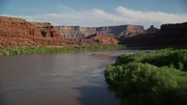 5.5K aerial stock footage fly low through Meander Canyon over Colorado River, Canyonlands National Park, Utah Aerial Stock Footage | AX138_105E