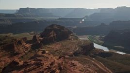 5.5K aerial stock footage of passing a butte overlooking Meander Canyon and Colorado River, Canyonlands National Park, Utah Aerial Stock Footage | AX138_113