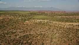 5.5K aerial stock footage fly over open desert to approach Shafer Canyon in Canyonlands National Park, Utah Aerial Stock Footage | AX138_146