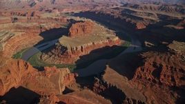 5.5K aerial stock footage of passing the Colorado River in the Goose Neck of Meander Canyon, Canyonlands National Park, Utah Aerial Stock Footage | AX138_163E