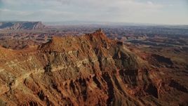 5.5K aerial stock footage orbit small butte with wide view of Canyonlands National Park, Utah Aerial Stock Footage | AX138_175E