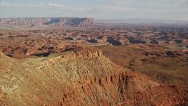 5.5K aerial stock footage orbit a small domed butte in Moab, Utah Aerial Stock Footage | AX138_185E