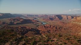 5.5K aerial stock footage of a wide view of the Colorado River, buttes and mesas seen from the edge of cliffs in Moab, Utah Aerial Stock Footage | AX138_194E