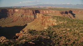 5.5K aerial stock footage fly over edge of a mesa overlooking a wide canyon in Moab, Utah Aerial Stock Footage | AX138_203E