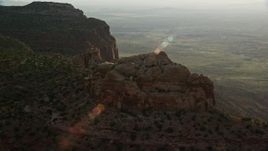 5.5K aerial stock footage tilt and approach mesa cliffs overlooking a hazy valley, Moab, Utah Aerial Stock Footage | AX138_253E