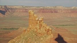 5.5K aerial stock footage orbit the side of North Six-Shooter Peak, Moab, Utah Aerial Stock Footage | AX138_269E
