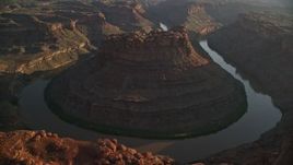 5.5K aerial stock footage circle The Loop East part of Meander Canyon and Colorado River, Canyonlands National Park, Utah, sunset Aerial Stock Footage | AX138_293E