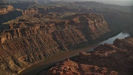 5.5K aerial stock footage pass The Loop West in Meander Canyon, and Colorado River, Canyonlands National Park, Utah, sunset Aerial Stock Footage | AX138_295E