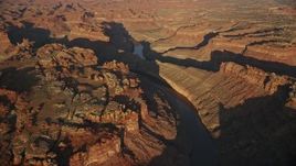 5.5K aerial stock footage orbit The Loop West, The Loop East parts of Meander Canyon and Colorado River, Canyonlands National Park, Utah, sunset Aerial Stock Footage | AX138_300E