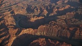 5.5K aerial stock footage of slowly orbiting the river in Meander Canyon, Canyonlands National Park, Utah, sunset Aerial Stock Footage | AX138_316